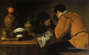  une - Deux jeunes hommes à une table Diego Velázquez